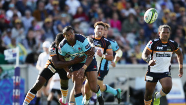Kurtley Beale is tackled by Tevita Kuridrani during a Waratahs match against the Brumbies in 2020. 