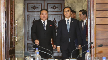 Cho Myoung-gyon, South Korea's unification minister, right, and Ri Son Gwon, chairman of North Korea's Committee for the Peaceful Reunification of the Fatherland, during a meeting in the Demilitarised Zone (DMZ) in Paju, South Korea, on Monday.