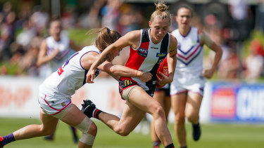Reeled in: Leah Mascall's gets to grips with St Kilda's Darcy Guttridge at RSEA Park in Moorabbin.