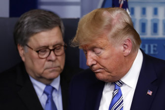 Then attorney-general William Barr, left, used the power of the Justice Department to support Donald Trump.