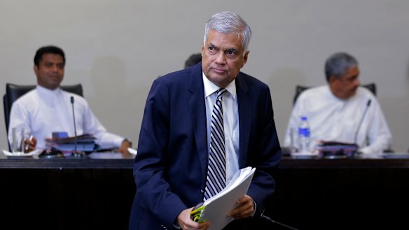 Sri Lankan Prime Minister Ranil Wickremesinghe leaves after testifying on Tuesday.