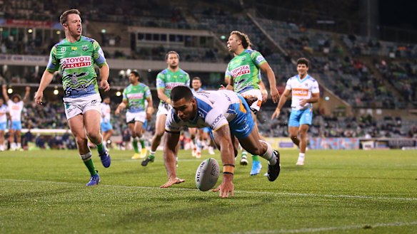Jamal Fogarty of the Titans adds to the Raiders’ misery in Canberra.
