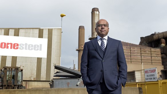 Sanjeev Gupta standing outside one of the OneSteel mills he bought in 2017.