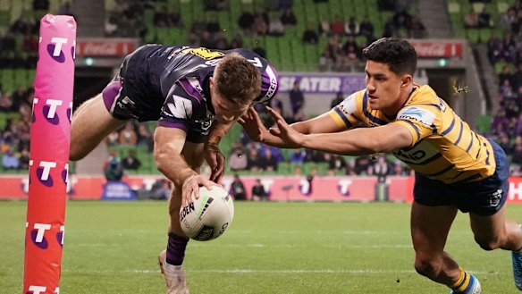 Ryan Papenhuyzen of the Melbourne Storm dives to score at AAMI Park.