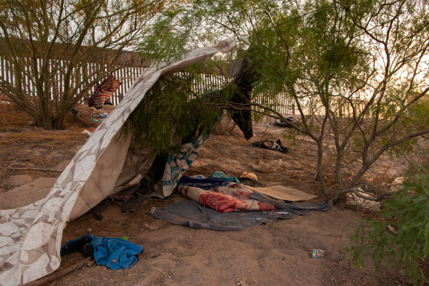 One day before Title 42 is set to be lifted, makeshift shelter and items are left behind by migrants along the US side of the wall in El Paso, Texas. 