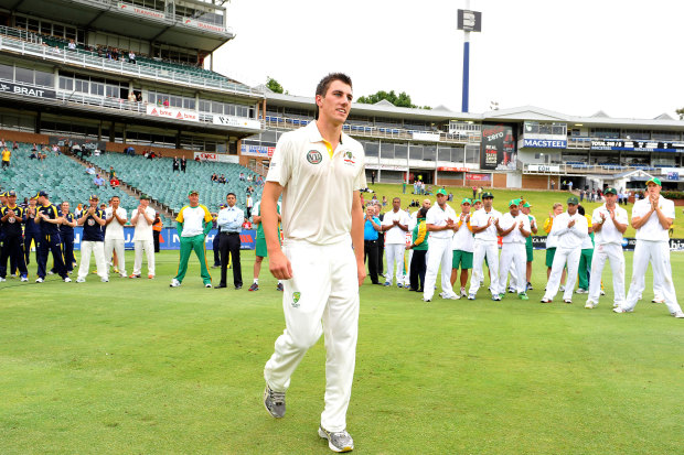 Cummins winning the man of the match award on his Test debut, against South Africa in 2011.