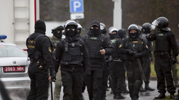 Belarusian riot police gather to block demonstrators during an opposition rally to protest the official presidential election results in Minsk, Belarus.