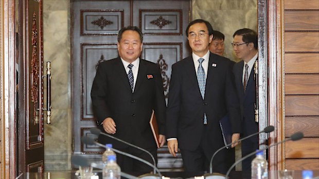 Cho Myoung-gyon, South Korea's unification minister, right, and Ri Son Gwon, chairman of North Korea's Committee for the Peaceful Reunification of the Fatherland, during a meeting in the Demilitarised Zone (DMZ) in Paju, South Korea, on Monday.