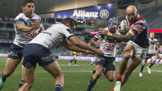 Stepping through: Blake Ferguson beats Johnathan Thurston to cross for the Roosters at Allianz Stadium.
