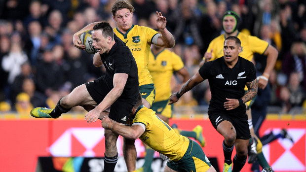 Free range: Ben Smith makes a half break in Bledisloe I in Sydney. The fullback made the break that set up New Zealand's first try just before half-time, in a classic case of striking with maximum psychological impact.