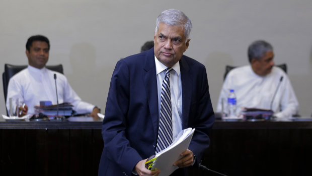 Sri Lankan Prime Minister Ranil Wickremesinghe leaves after testifying on Tuesday.