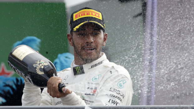 Lewis Hamilton celebrates extending his championship lead at Monza on Sunday.