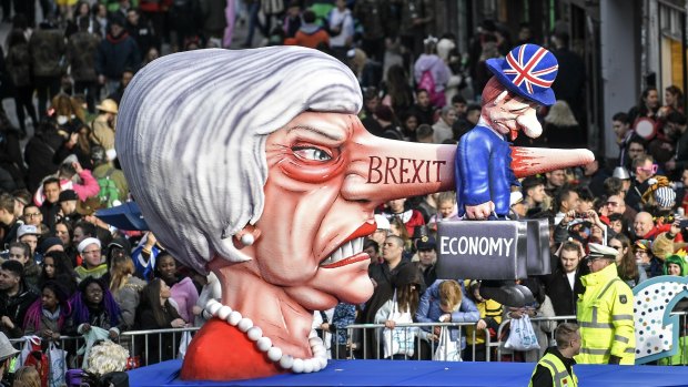 A carnival float depicts British Prime Minister Theresa May and the Brexit during the traditional carnival parade in Duesseldorf, Germany. 