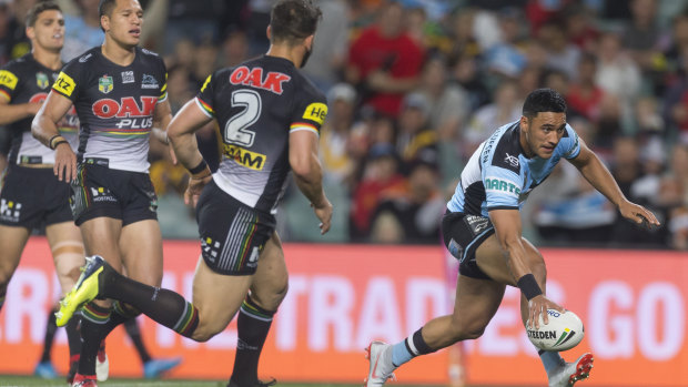 Hot streak: Valentine Holmes scores after Sosaia Feki had hit the ball back against the Panthers at Allianz Stadium.