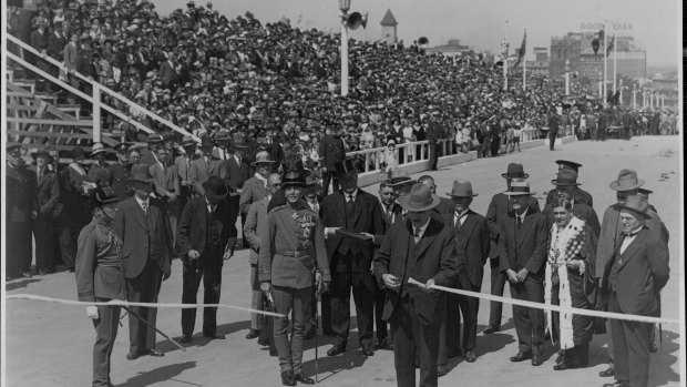 Premier Jack Lang cuts the ribbon during the opening ceremony. 