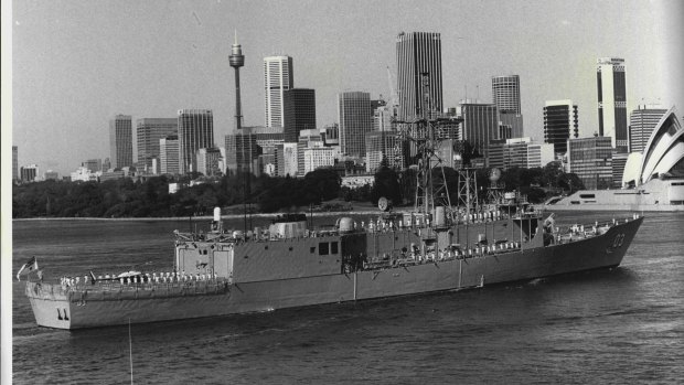 HMAS Sydney steams up-Harbour towards circular Quay for the first time.