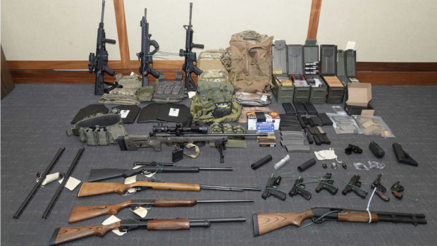 This image provided by the US District Court in Maryland shows a photo of firearms and ammunition that was in the motion for detention pending trial in the case against Christopher Paul Hasson. 