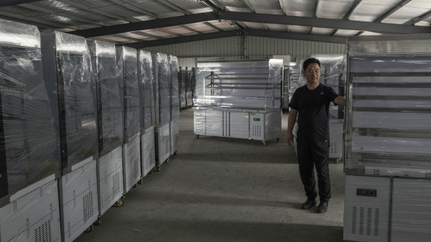 Wang Xuechuan, who said profit margins were tight because of increasing labour costs, in a storage room at a factory in Xingfu, China.