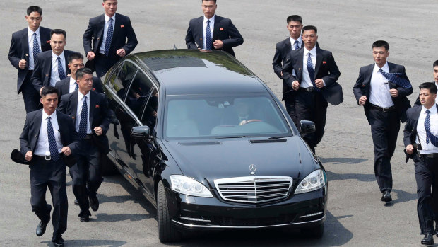 North Korean security men surround Mercedes carrying North Korean leader Kim Jong-un before meeting South Korean President Moon Jae-in in April. 