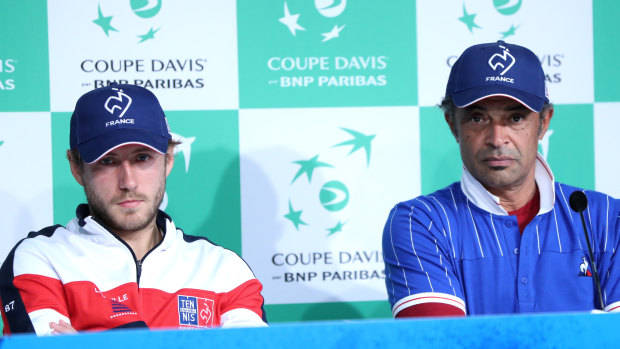 Dejected: Yannick Noah (right), alongside Lucas Pouille, is lamenting what he says is the demise of the Davis Cup.
