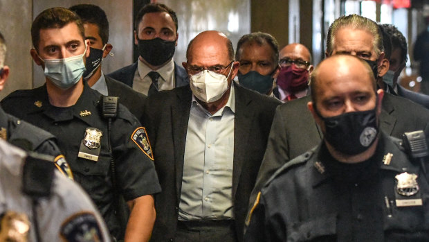 Allen Weisselberg, chief financial officer of Trump Organisation, centre, walks towards a courtroom in New York.