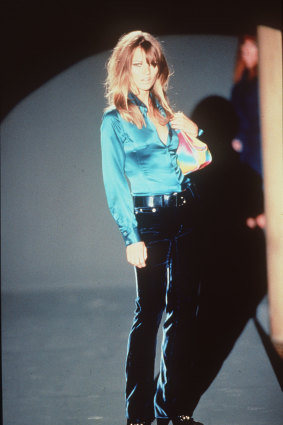 Kate Moss walking for Gucci in 1995.