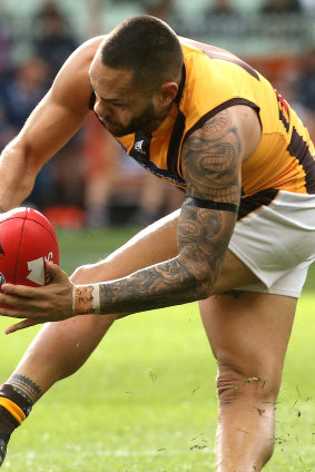 Jarman Impey hyperextends his knee after taking a mark against Geelong on Sunday. 