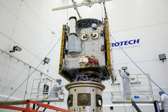 Technicians at work inside the clean room at Astrotech Space Operations facility in Titusville, Florida.