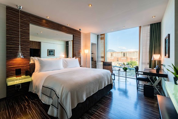 Watch ferries from a Deluxe Harbour View room.