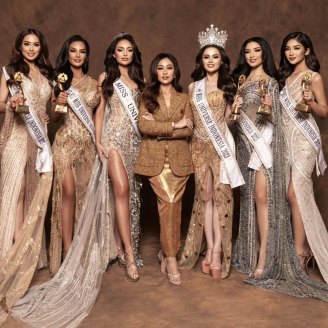 Poppy Capella (centre), the national director of the Miss Universe event in Indonesia, with contestants. 