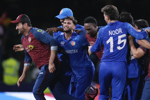 Afghanistan players celebrate their T20 World Cup win against Australia.