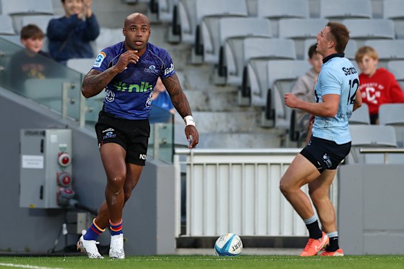 Mark Telea of the Blues celebrates after scoring the opening try.