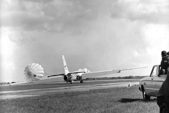 U-2 plane soon after landing with its braking parachute billowing behind.