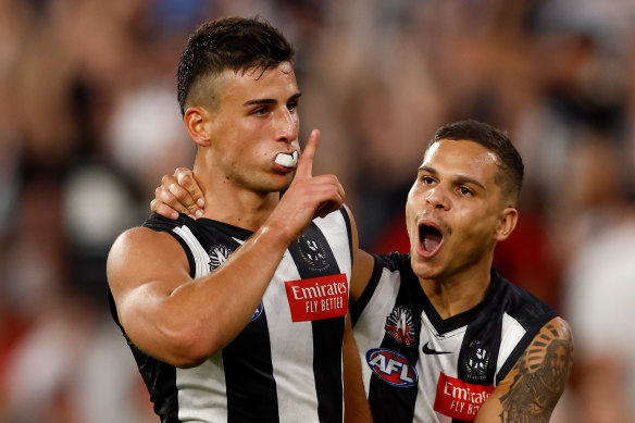Nick Daicos of the Magpies celebrates a goal.