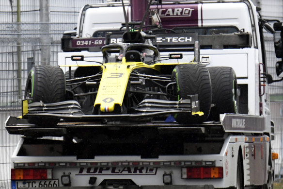 Daniel Ricciardo's Renault is carried away on the back of a tow truck after failing to finish the German Formula One Grand Prix at the Hockenheimring racetrack.
