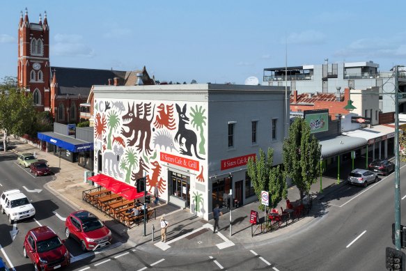 The shop is occupied by 8 Sisters Cafe & Grill and bike retailer Giant.