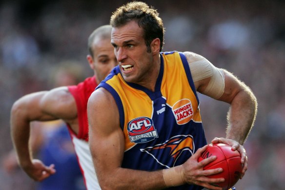 On the run: Chris Judd with West Coast.