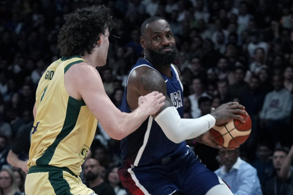 NBA legend LeBron James looks for a way past the Boomers’ Josh Giddey during a warm-up match earlier this month. 