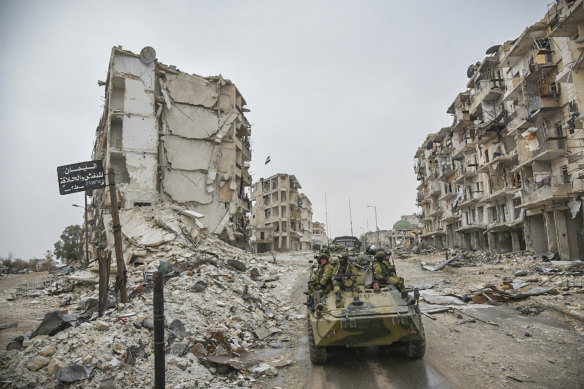 A Russian army vehicle drives through Aleppo, Syria, in 2019.