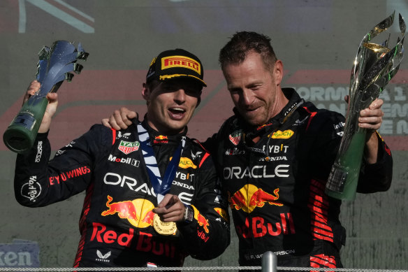 Red Bull driver Max Verstappen and engineer Richard Wolverson celebrate on the podium after winning the Formula One Mexico Grand Prix, their 16th triumph from 19 races this season.
