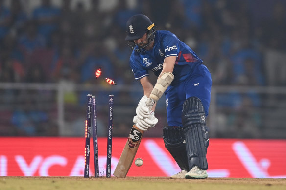 Mark Wood is bowled by Jasprit Bumrah.