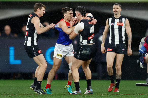 Brayden Maynard of the Magpies and Jack Viney of the Demons clash.