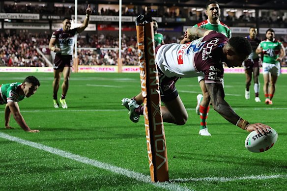 Manly winger Jason Saab scores his second try.
