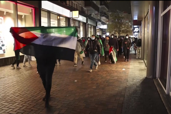Palestine supporters march through Amsterdam on Thursday night.