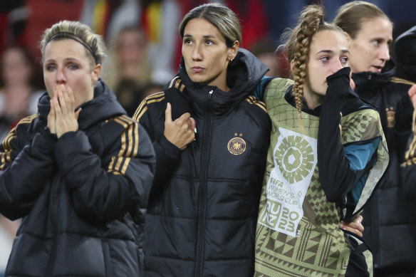German players react following their shock exit in Brisbane on Thursday night.