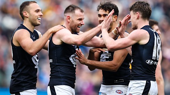 MELBOURNE, AUSTRALIA - JULY 02: Sam Docherty of the Blues celebrates a goal with teammates during the 2023 AFL Round 16 match between the Hawthorn Hawks and the Carlton Blues at the Melbourne Cricket Ground on July 2, 2023 in Melbourne, Australia. (Photo by Dylan Burns/AFL Photos via Getty Images)