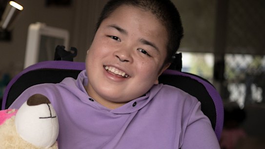 Jessie Mei Mei, 20, with her host parents Cindy Lorenz and Gared O’Neill. Jessie was diagnosed with Sanfillipo Syndrome at 4 years old- the root cause of her childhood dementia.