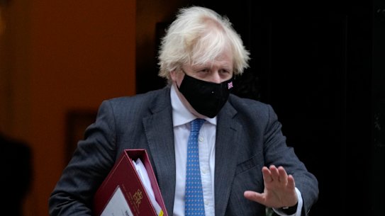 Not cancelling Christmas: Britain’s Prime Minister Boris Johnson waves as he leaves 10 Downing Street.