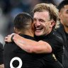 Damian McKenzie and Aaron Smith celebrate a comprehensive New Zealand win in Paris.