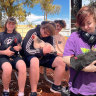 The students sit with the chickens during recess and lunch.